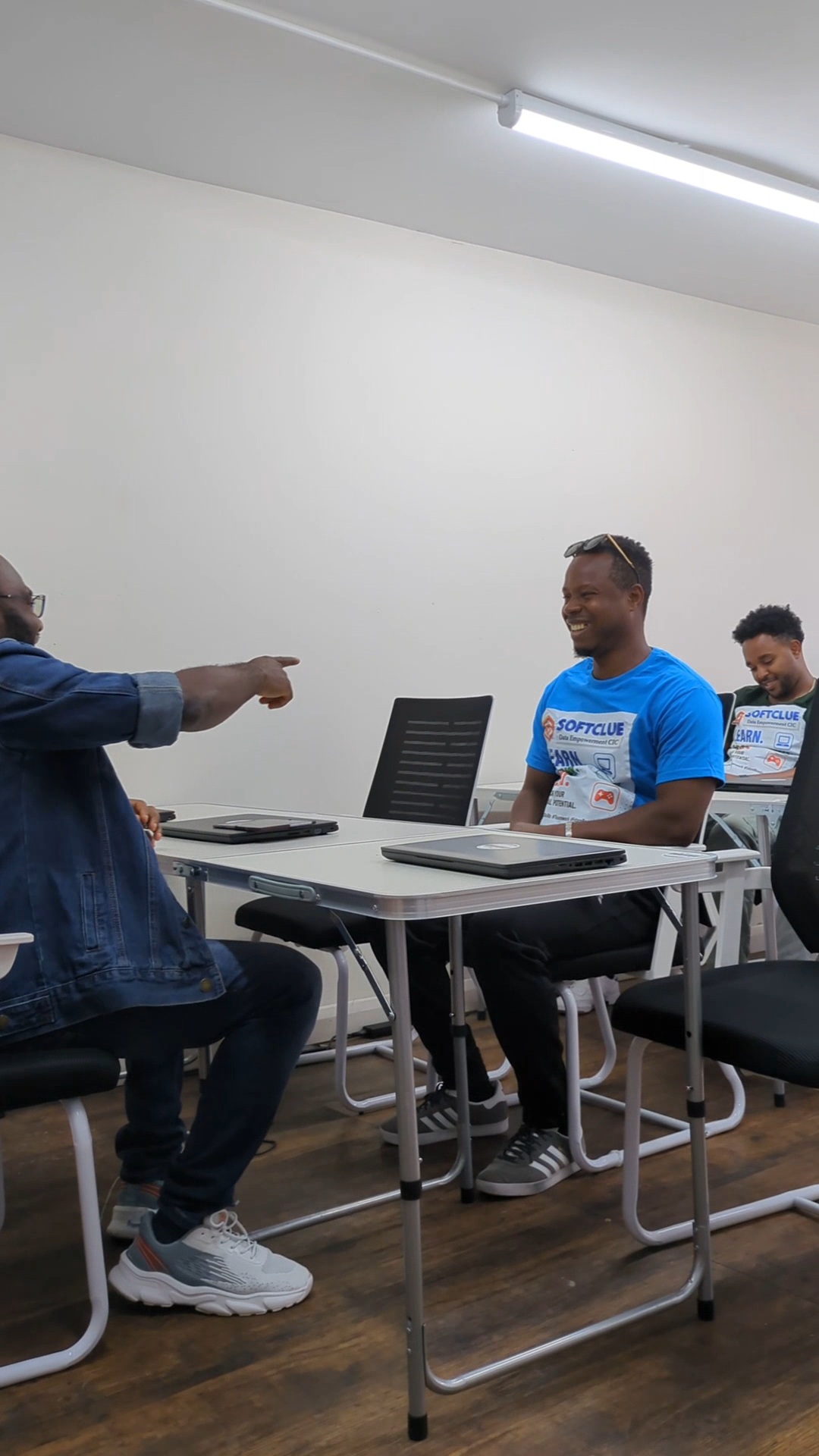 Trainer coaching a smiling learner across the table