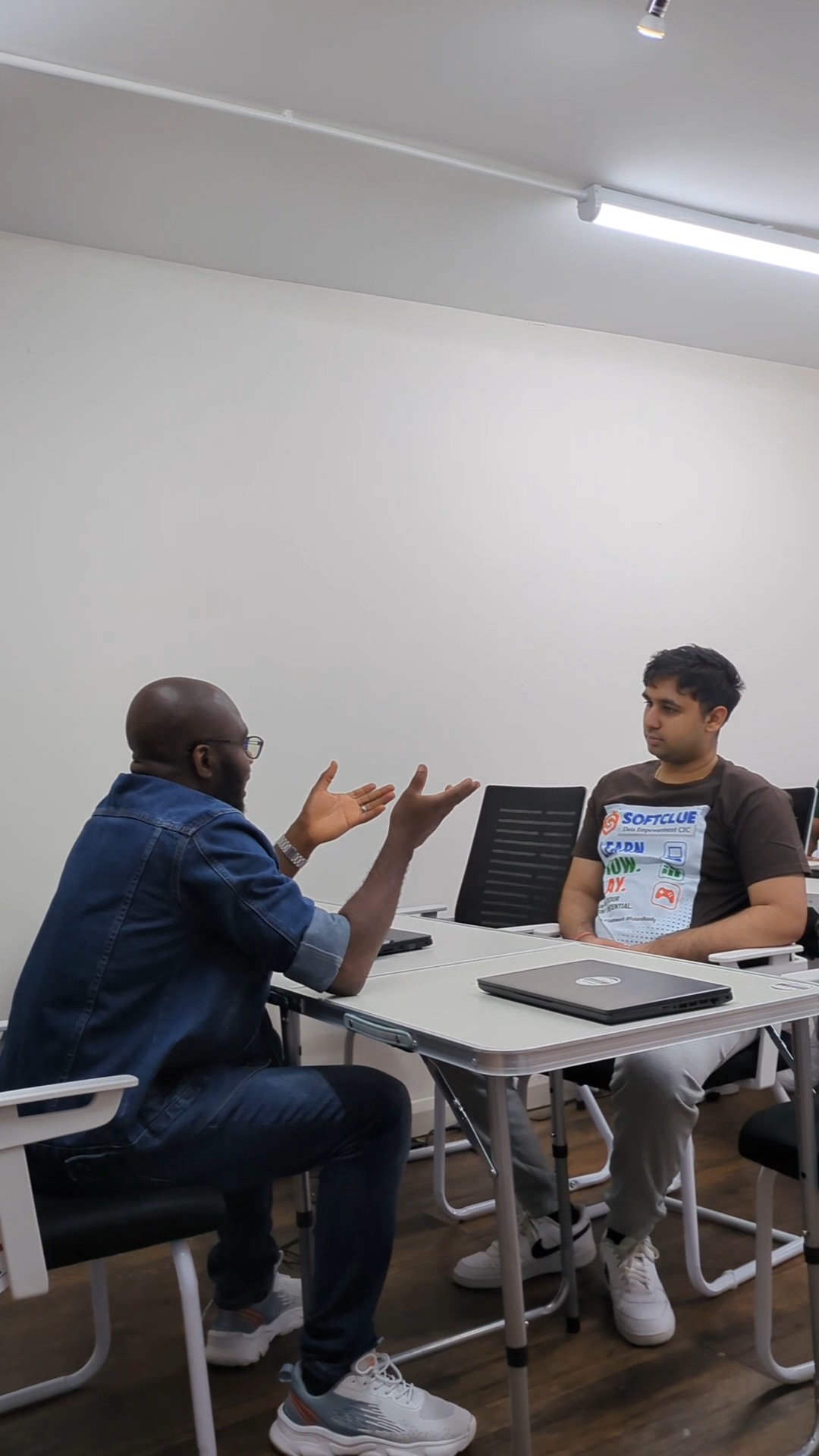 Trainer explaining a concept to a learner during a session